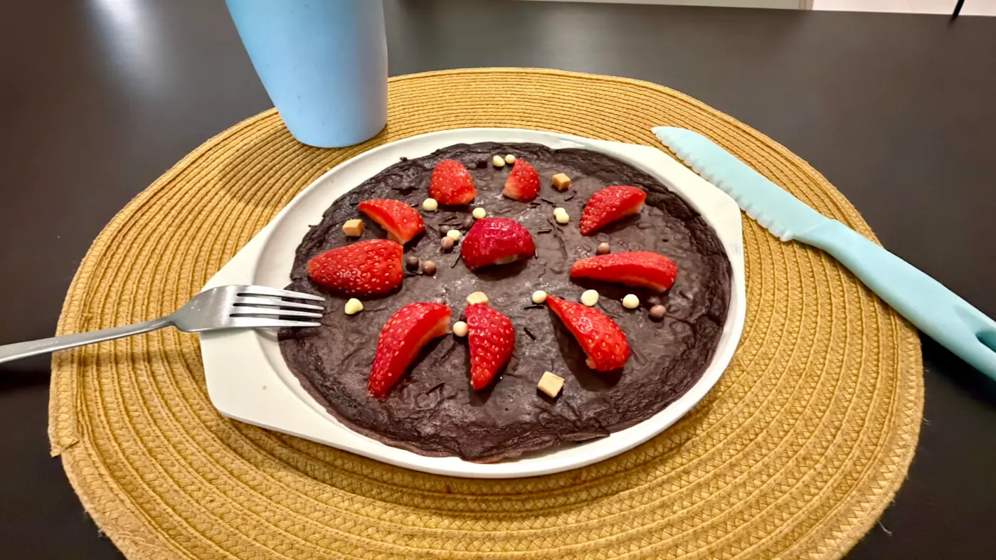 Homemade chocolate pancake with strawberries